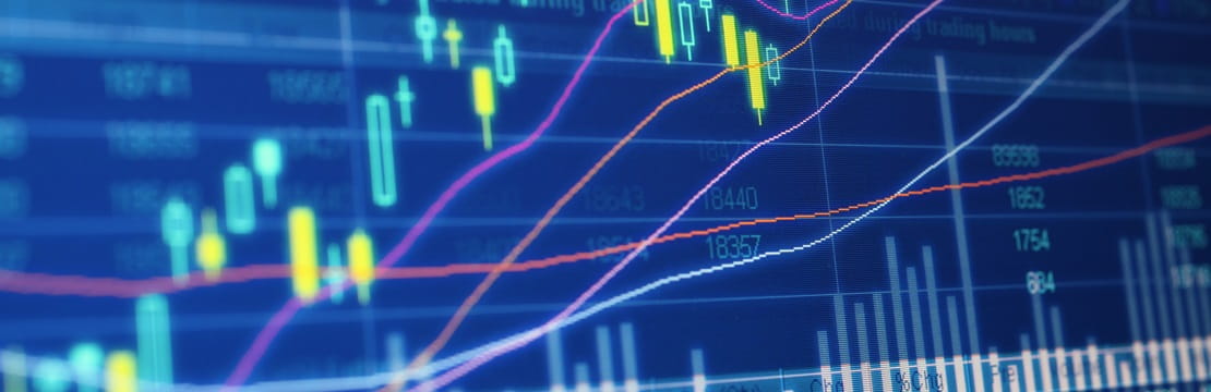 Stock market data projected onto a blue-colored screen