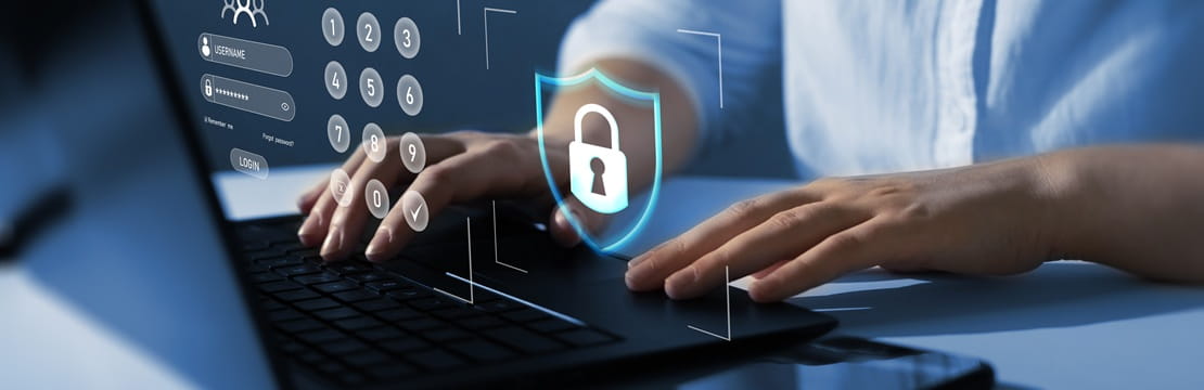 Laptop user practicing cybersecurity best practices to protect personal information online.